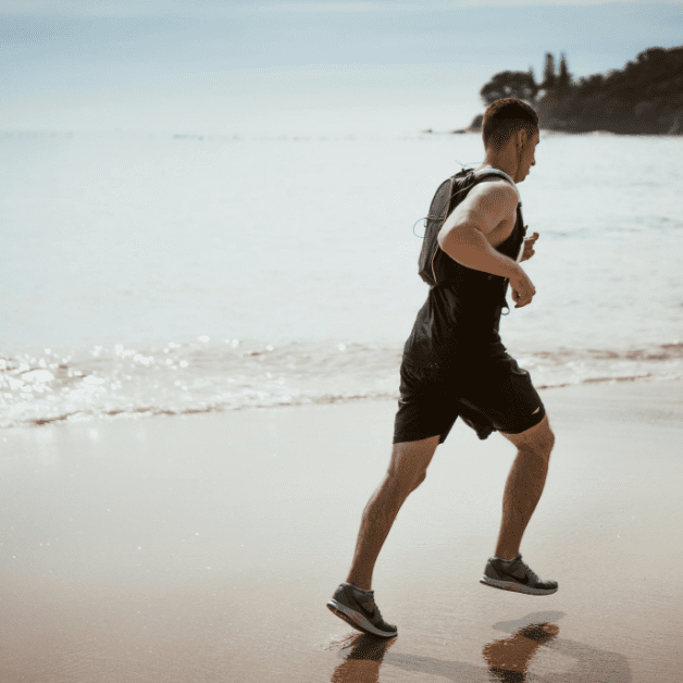 Runner in Vest on Beach